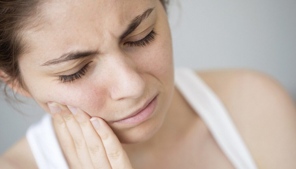 Young woman with toothache