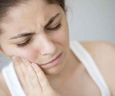 Young woman with toothache