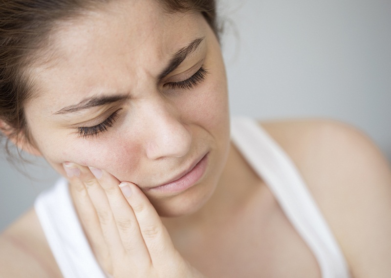 Young woman with toothache